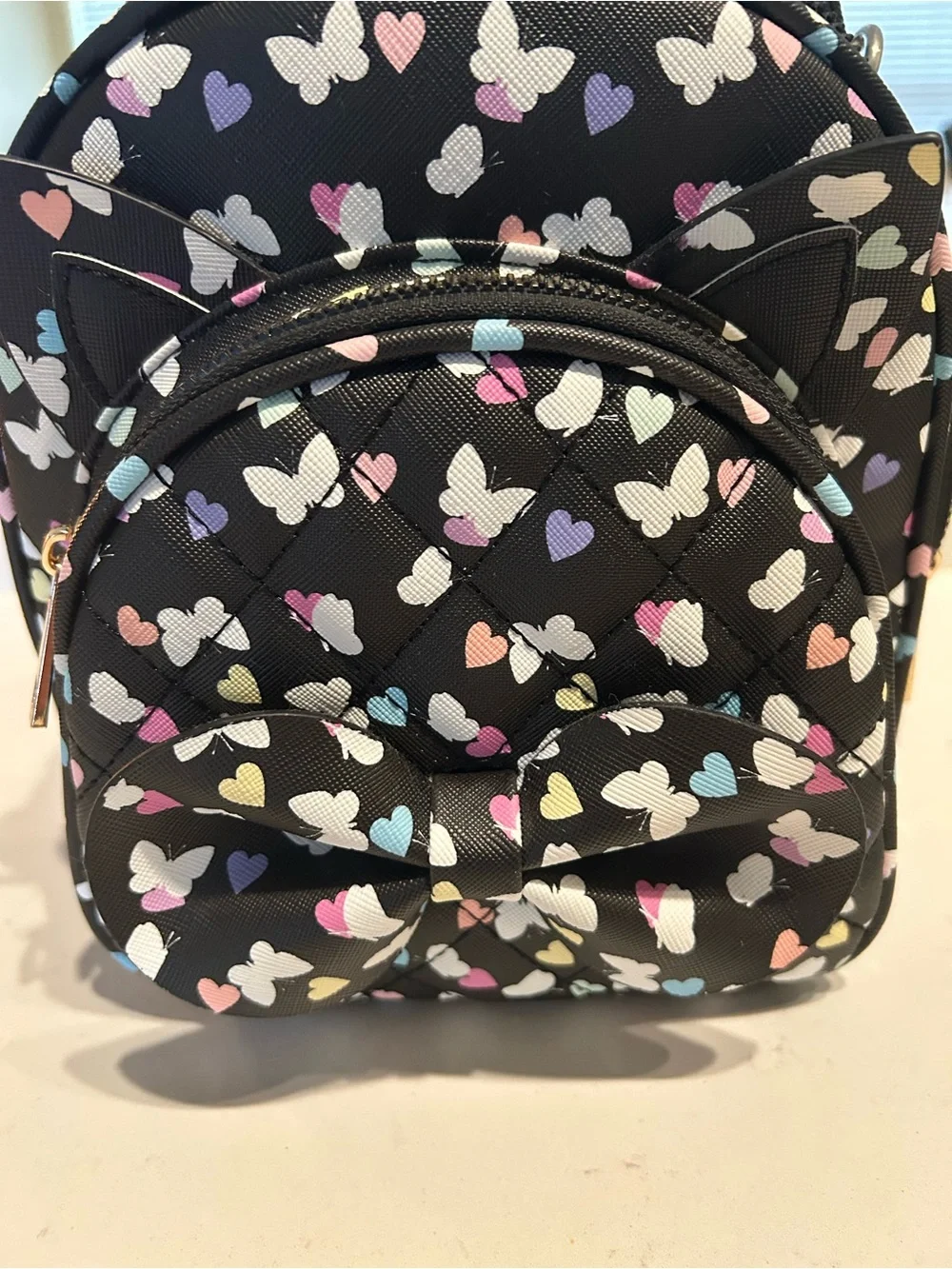 UnderOneSky Black Mini Backpack with Pastel Butterfly Print